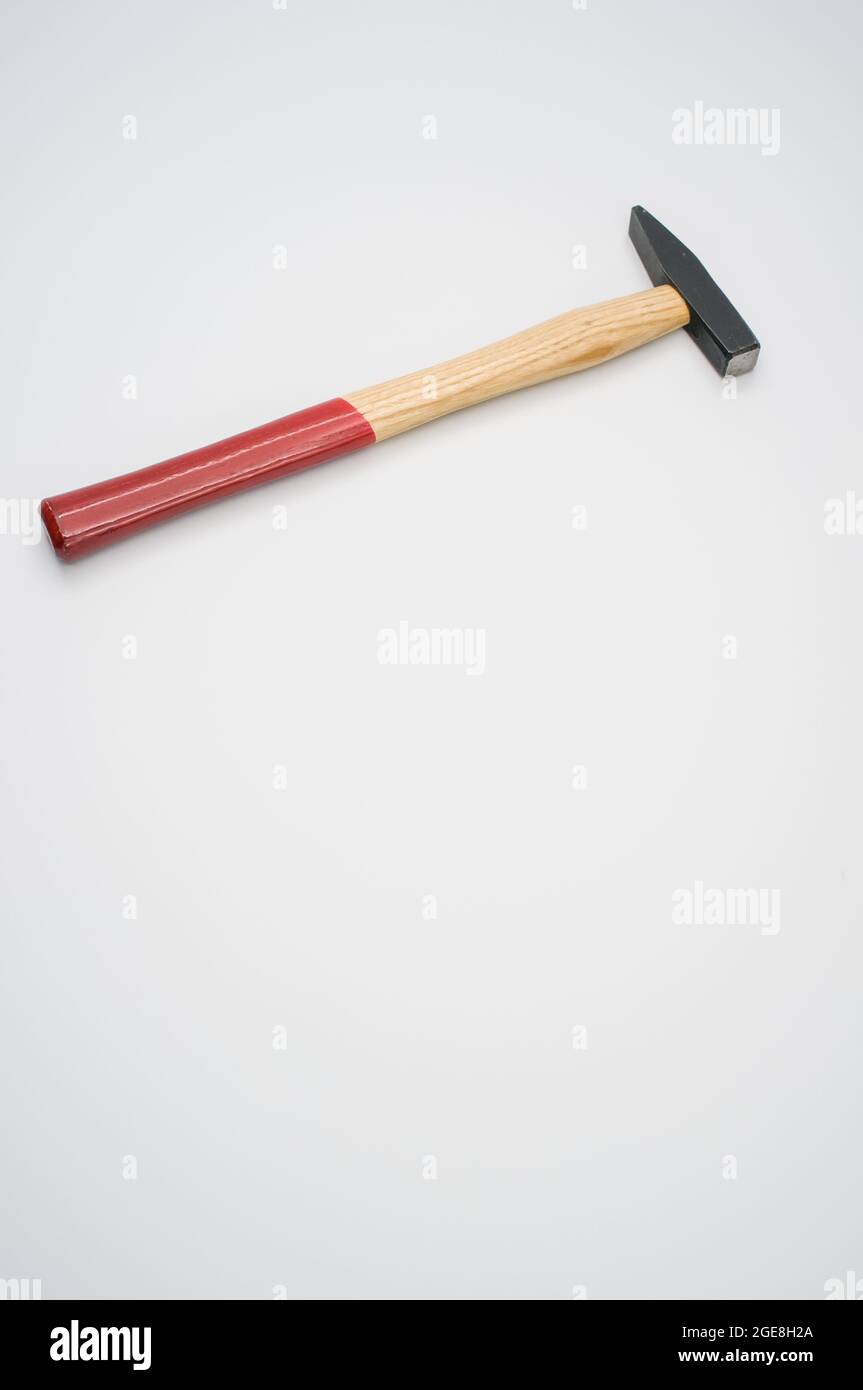 Machinist hammer with wooden handle isolated on a white background with free space for text