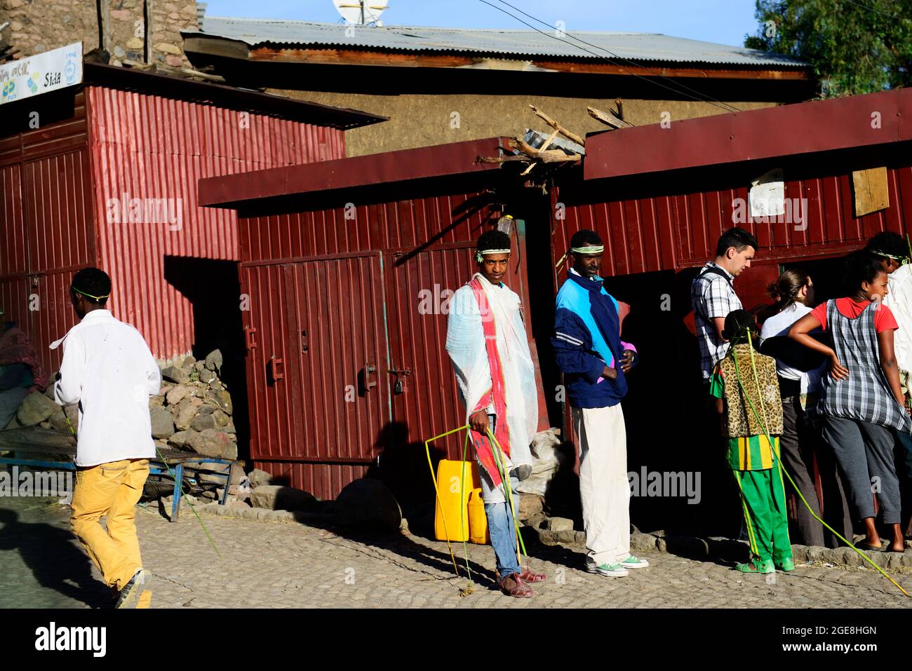 Ethiopians and tourist at a bus ticket office  in Lalibela, Ethiopia. Stock Photo