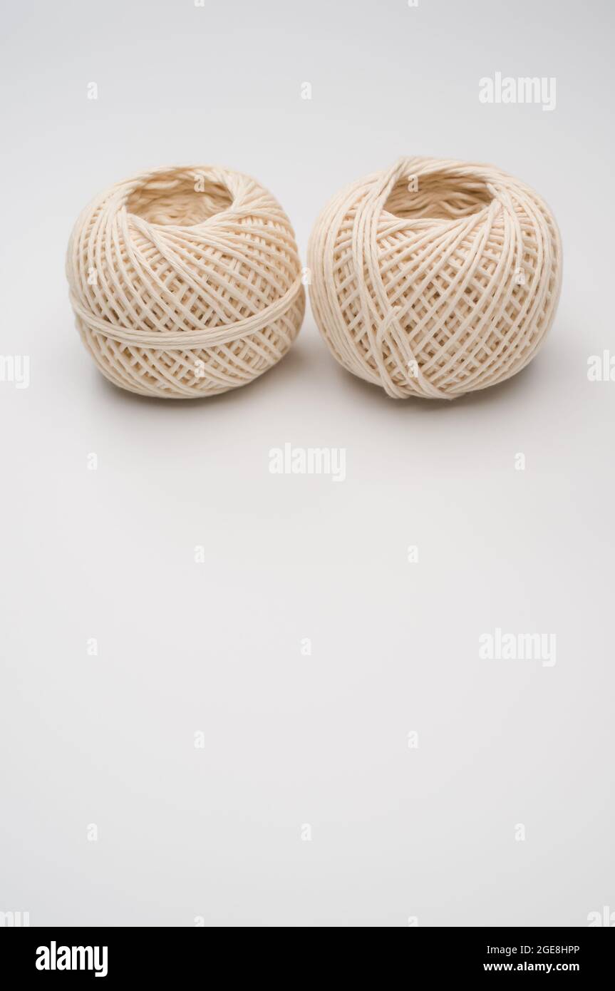 Vertical shot of jute twine balls isolated on white background Stock