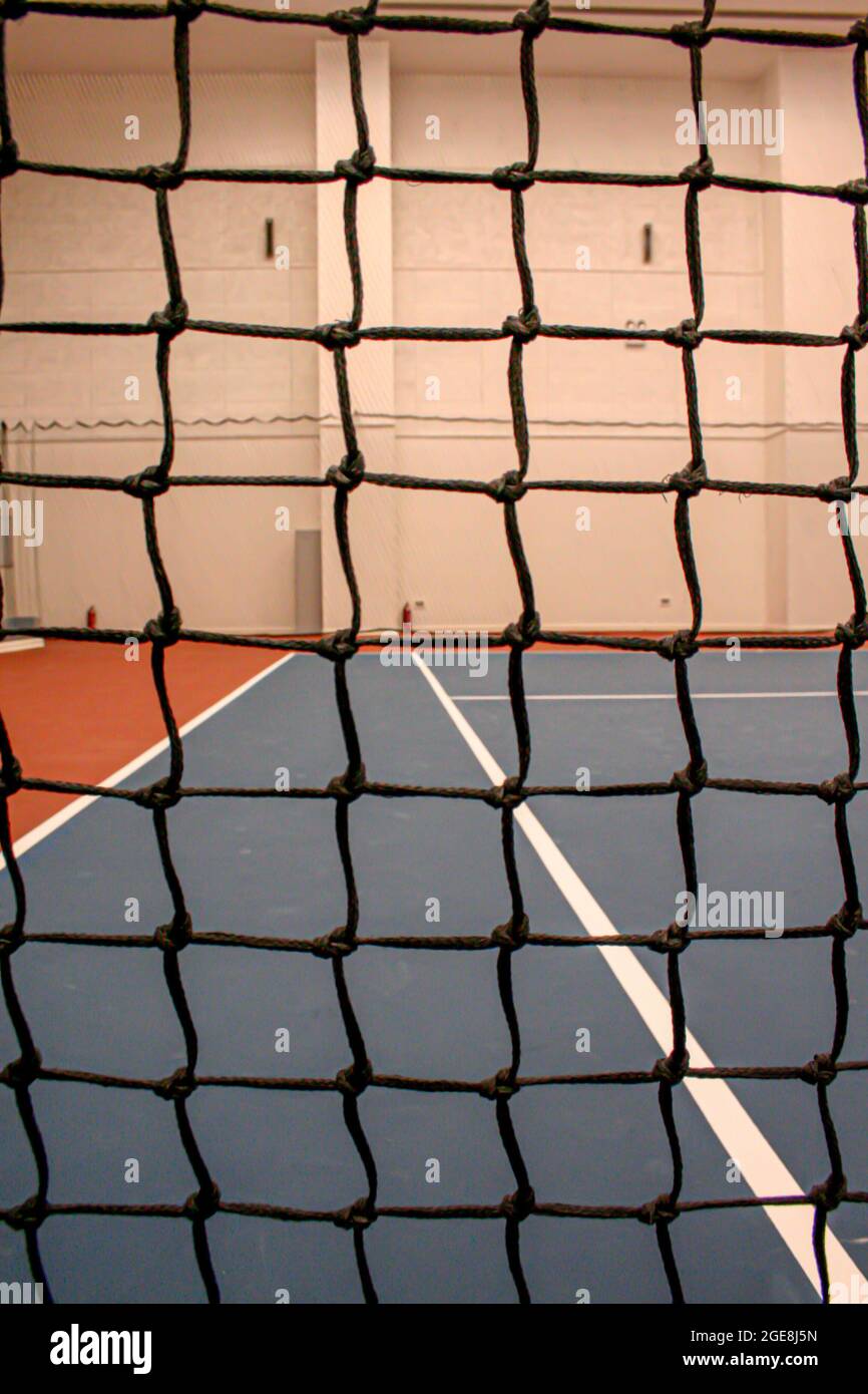 Tennis net at indoor tennis court building Stock Photo Alamy
