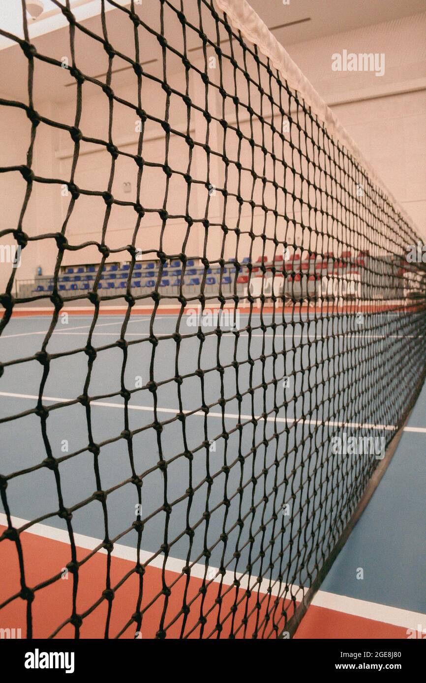 Tennis net at indoor tennis court building Stock Photo Alamy