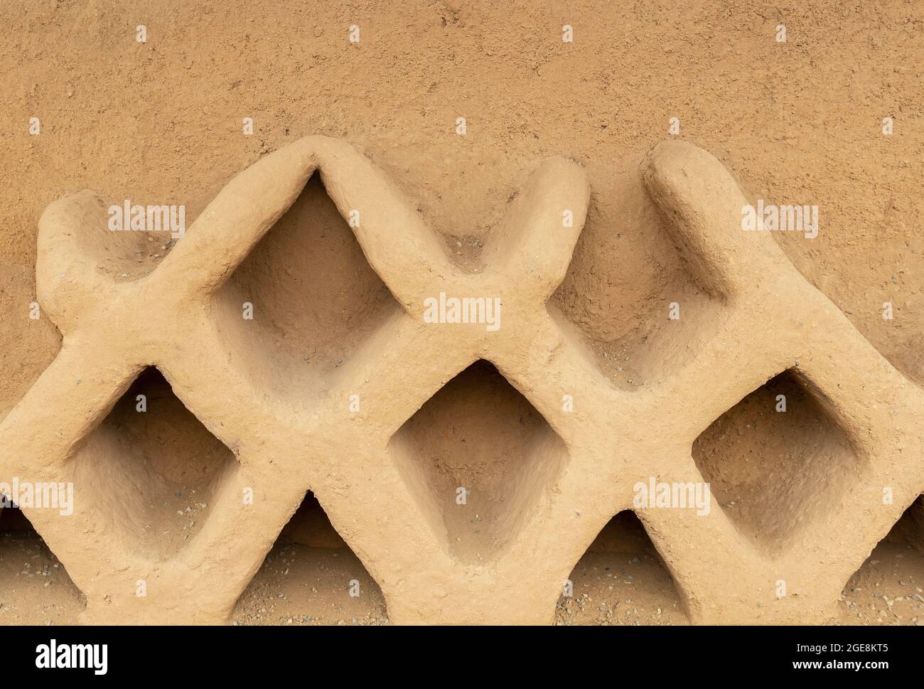 Adobe decorations on a wall in Chan Chan adobe city, Trujillo, Peru. Stock Photo