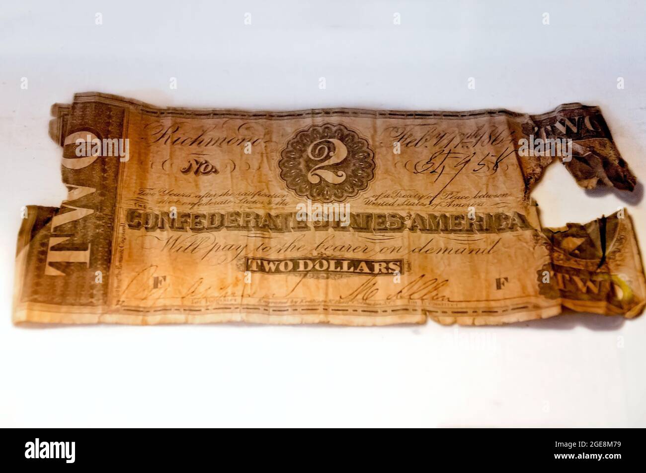 A Confederate two-dollar bill dated Feb. 17, 1864, the final year the Confederate States printed money, is displayed at Fort Gaines museum. Stock Photo