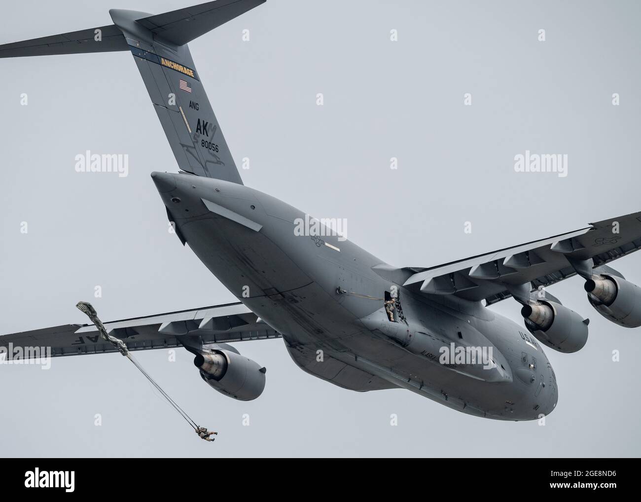 U.S. Army soldiers jump from the side of a C17 Globemaster III during