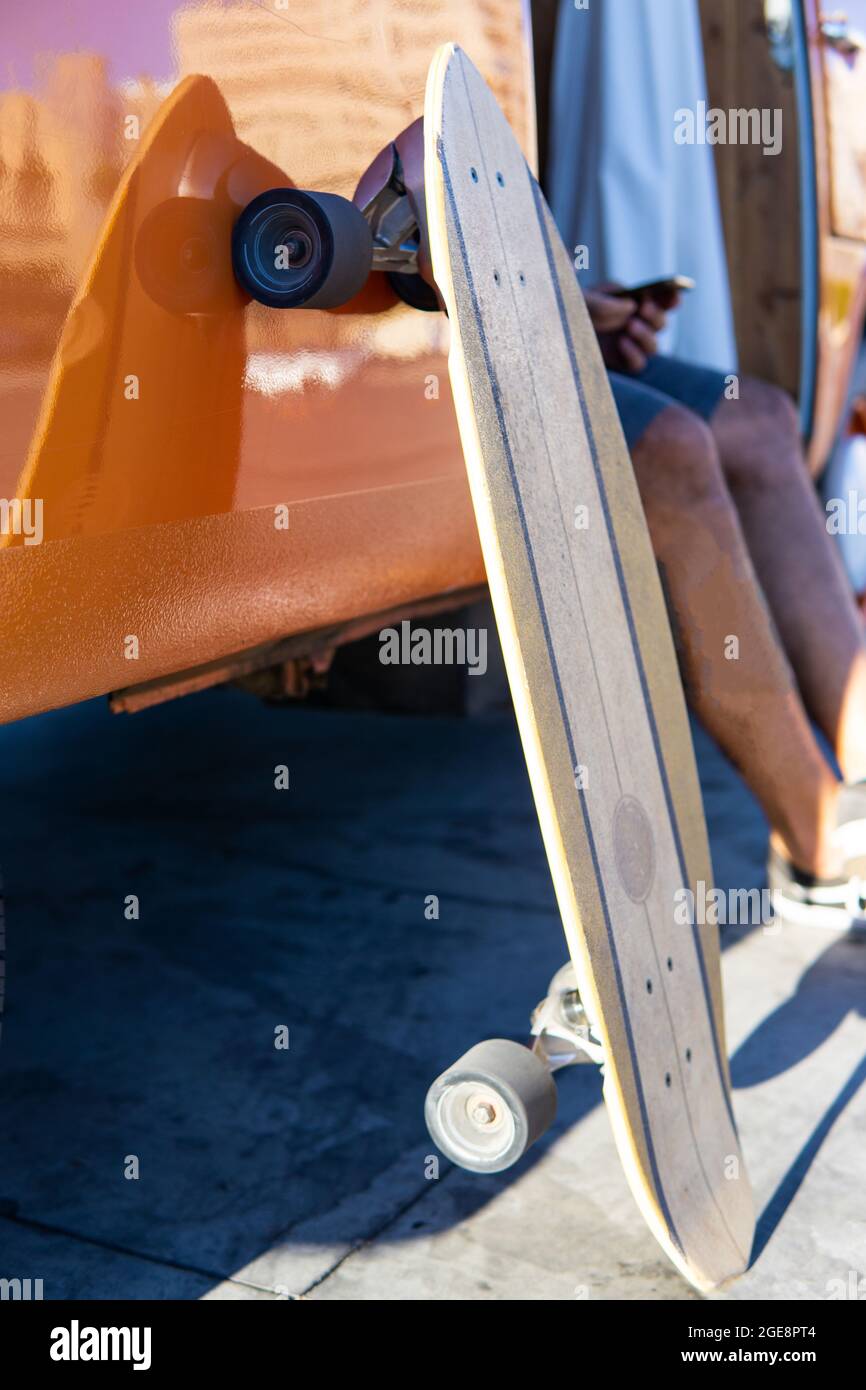 Isolated surfskate skateboard leaning on a vintage van Stock Photo Alamy