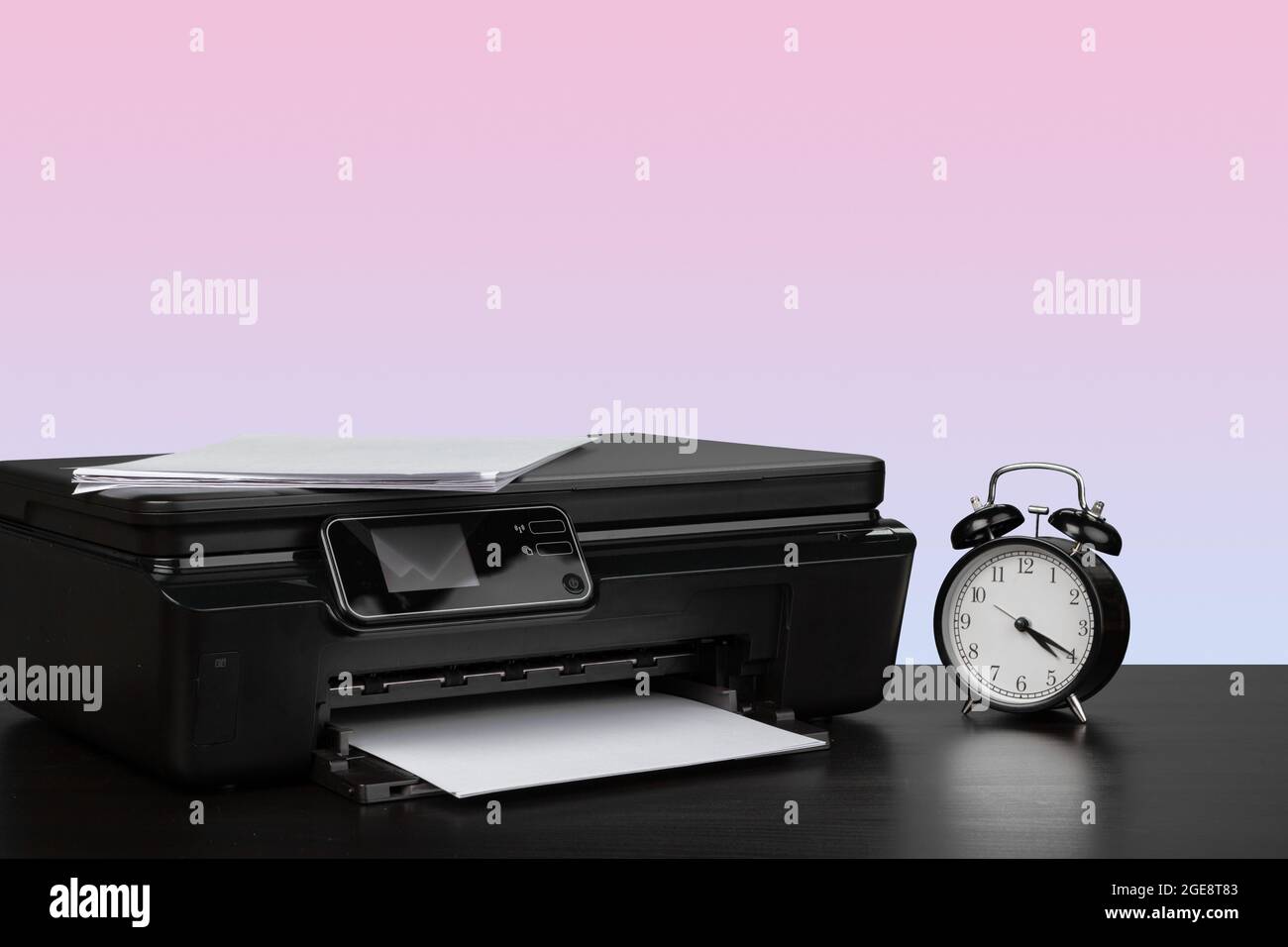 Compact home laser printer against pink background Stock Photo