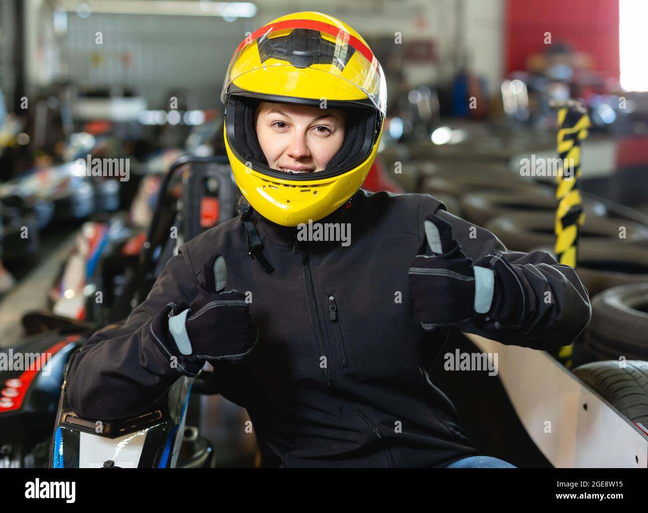Woman racing suit helmet hi-res stock photography and images - Alamy