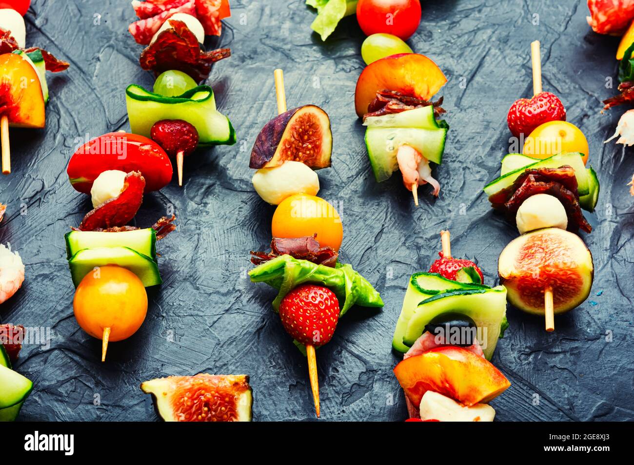 Buffet appetizer of shrimps, jamon, fruits and vegetables.Fresh summer