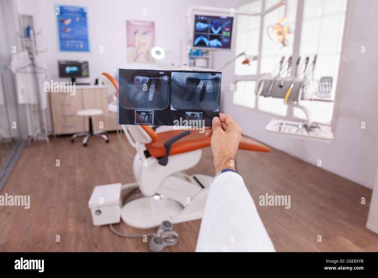 Specialist radiologist analyzing tooth dental medical radiograph