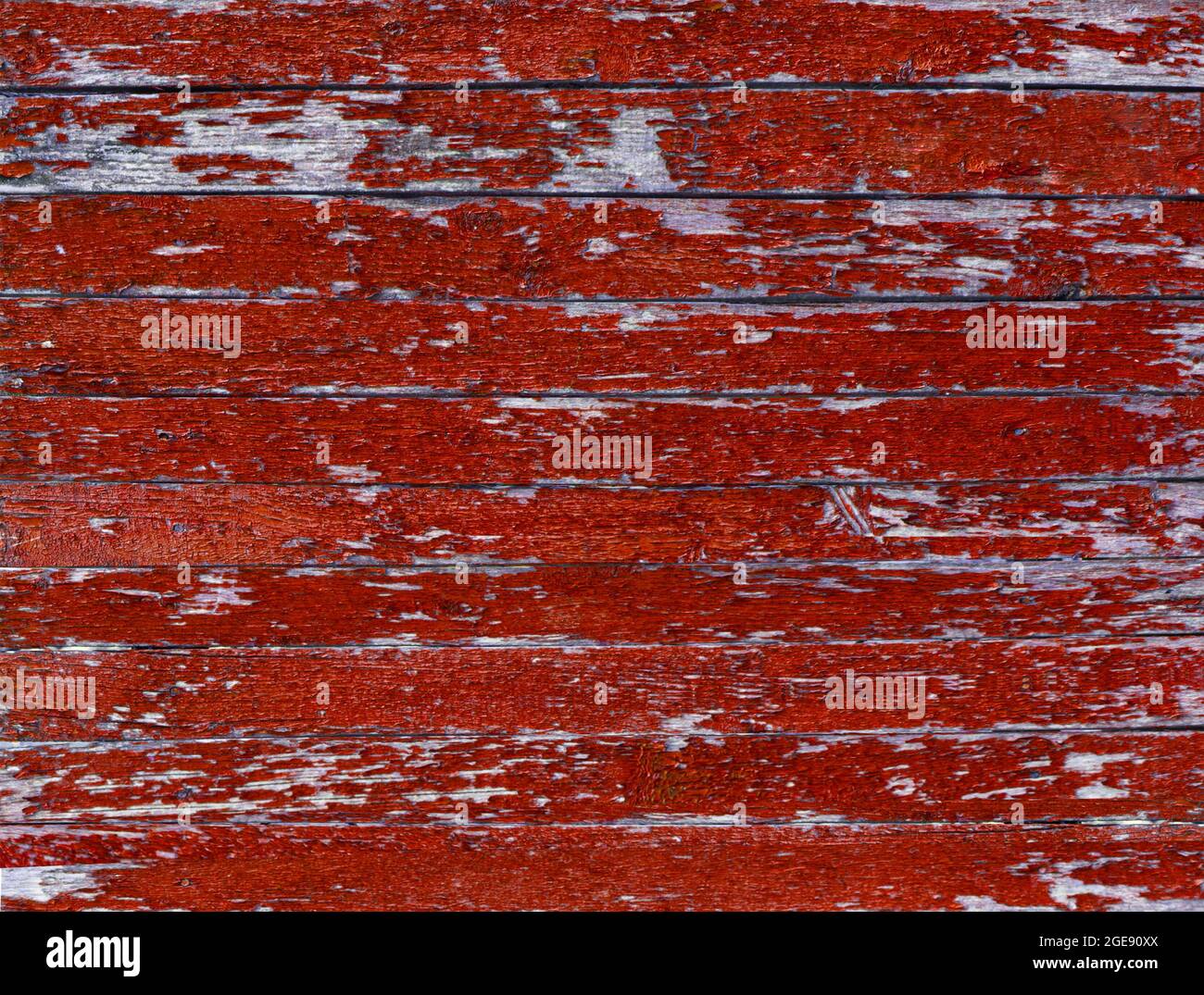 Color-Peel wood texture. Old wooden painted light red rustic fence, paint peeling background Stock Photo