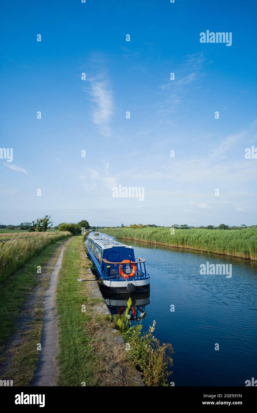 Moored narrowboat on the Leeds & Liverpool canal at Halsall, Lancashire Stock Photo