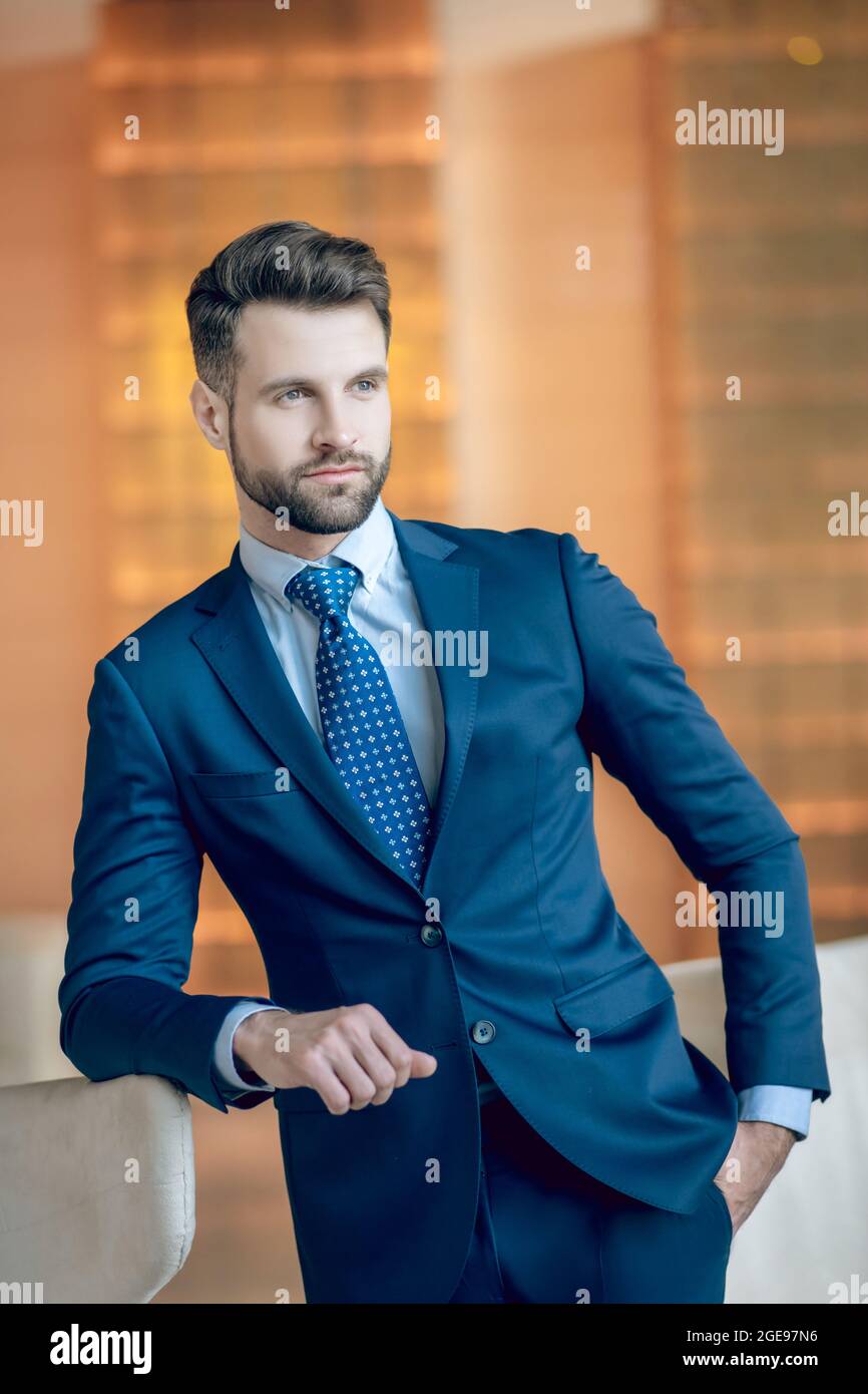 Picture of a handsome man in a nice blue suit and tie Stock Photo - Alamy