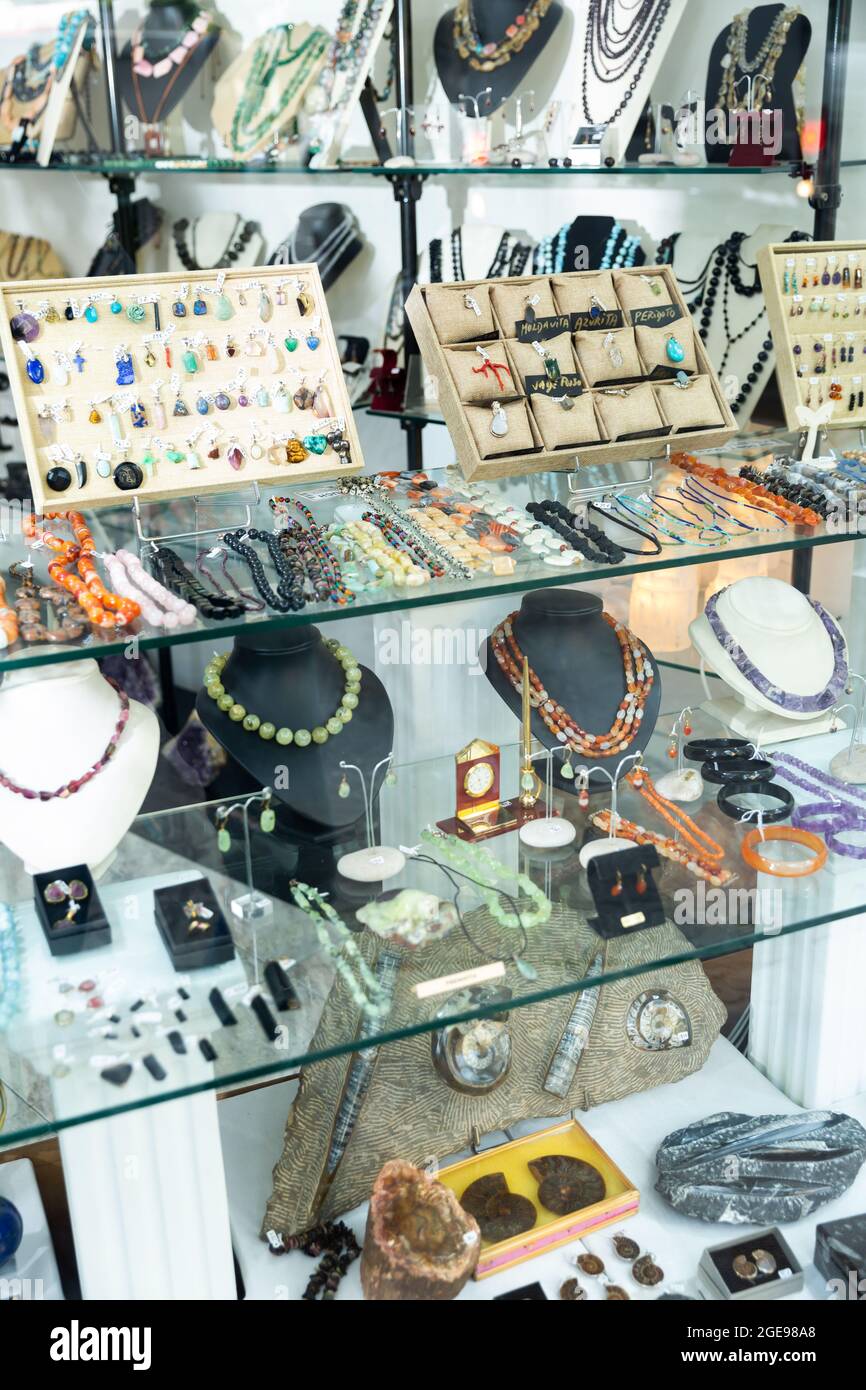 Showcase with natural stone jewelry in jewelry shop Stock Photo Alamy