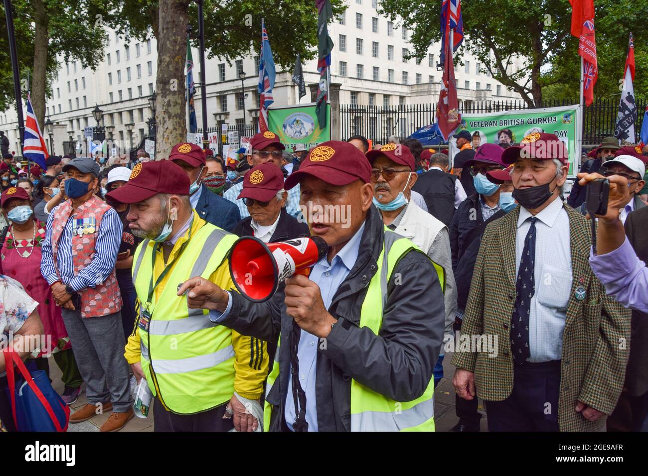 London, United Kingdom. 14th August 2021. Gurkha veterans protest outside Downing Street. Gurkhas have staged hunger strikes and protests for several weeks against 'discrimination, exploitation and historic injustice', including the unequal pensions given to Gurkha soldiers compared to their British counterparts. Stock Photo