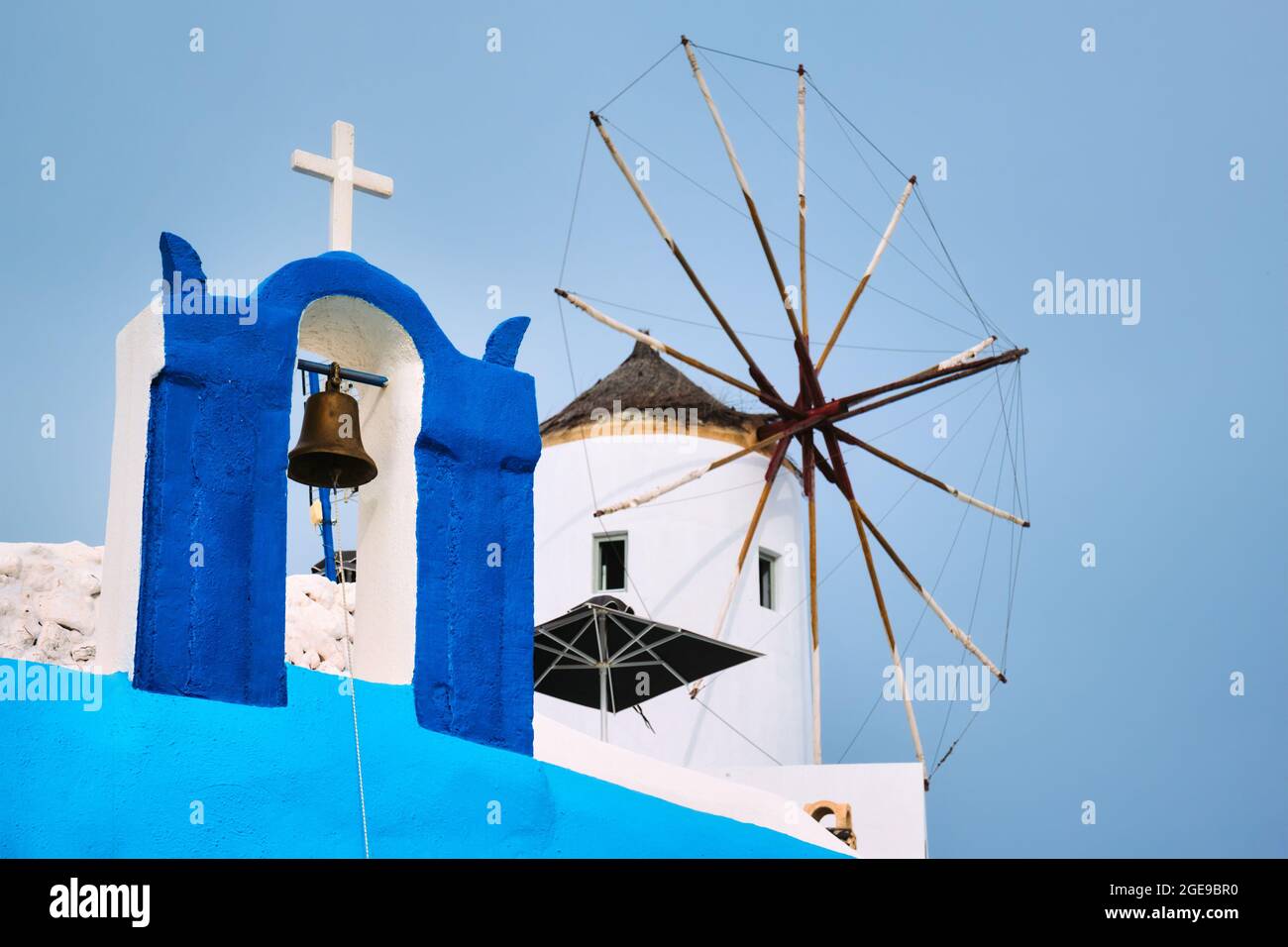 Old greek windmill on Santorini island in Oia town with stairs in street. Santorini, Greece Stock Photo