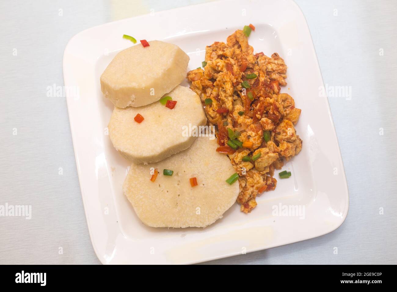 Cooked yam with fried egg sauce Stock Photo Alamy