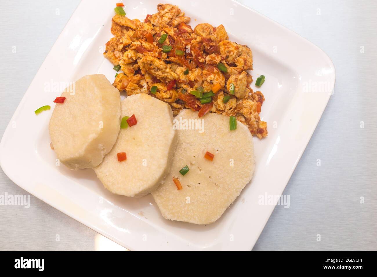 Cooked yam with fried egg sauce hires stock photography and images Alamy