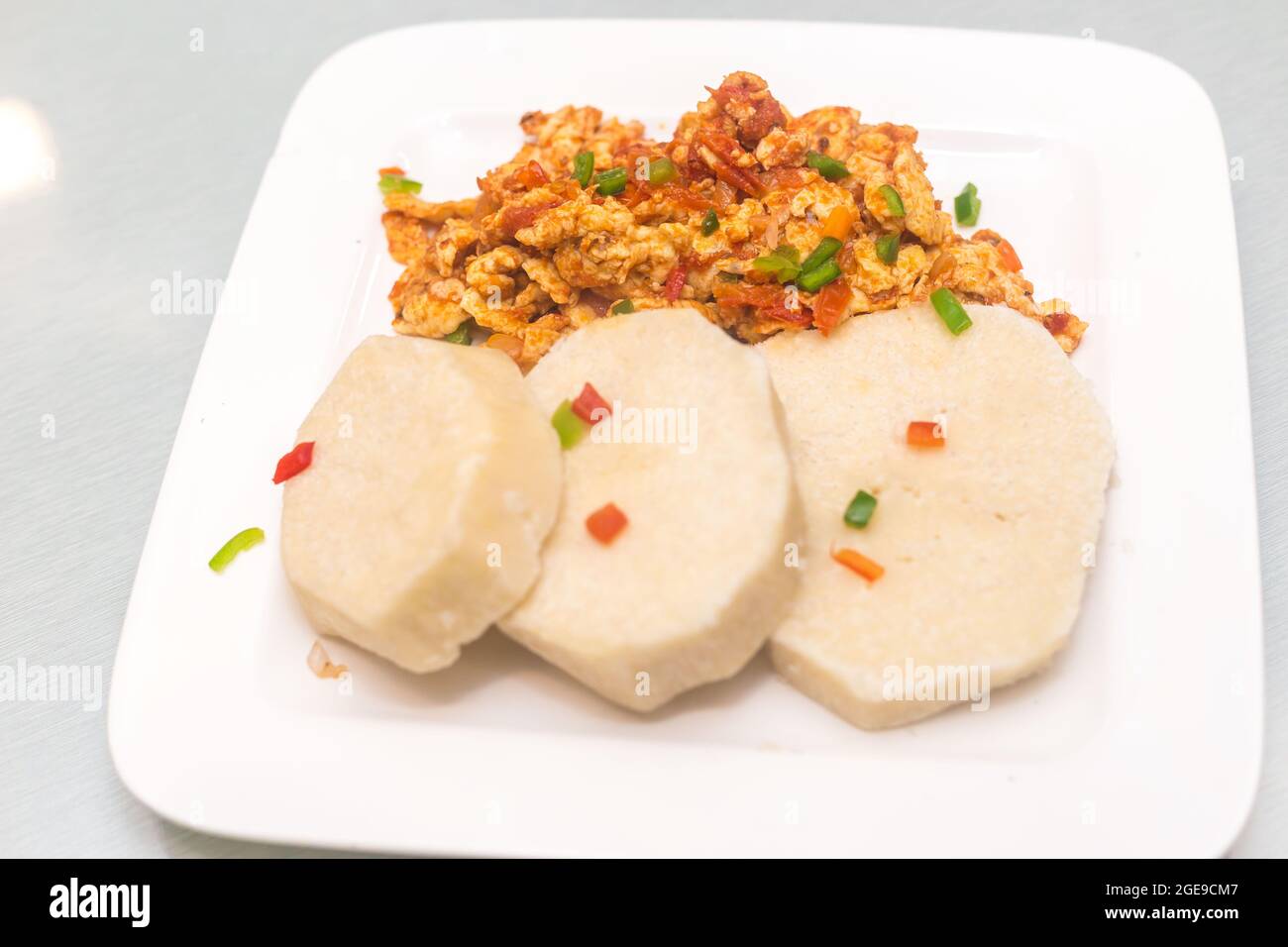 Cooked yam with fried egg sauce hires stock photography and images Alamy