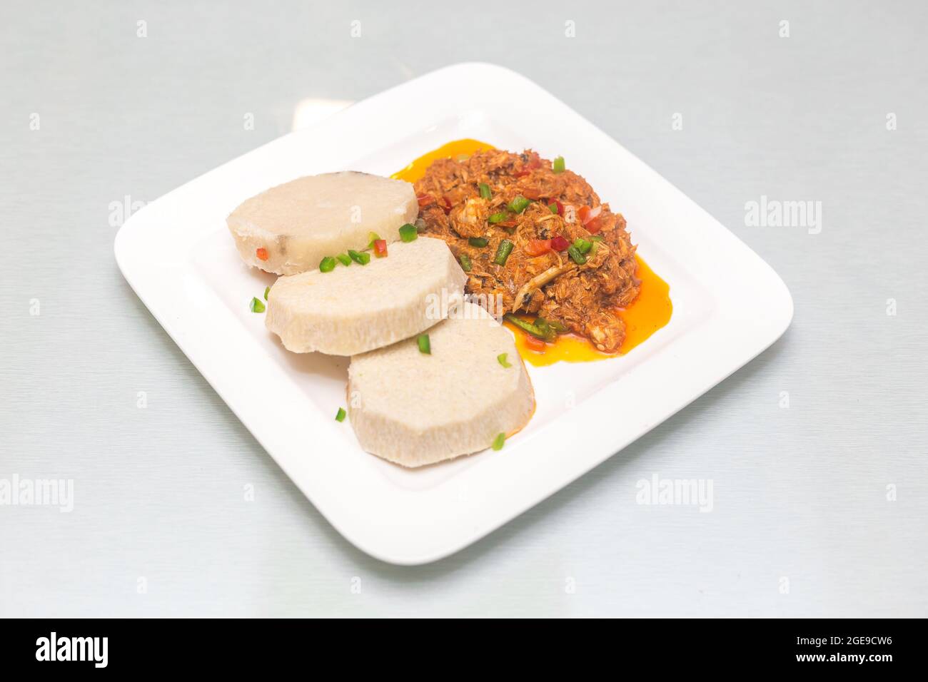 Cooked yam with fried egg sauce Stock Photo Alamy