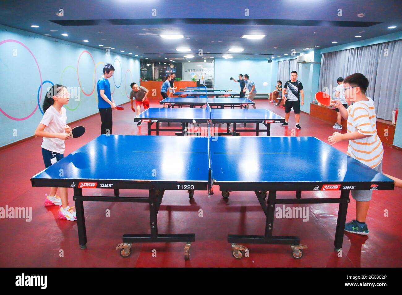 SHANGHAI, CHINA - AUGUST 12, 2020 - Children play table tennis in Shanghai,  China, Aug. 12, 2021. August 16, 2021 - Per capita sports consumption in  China has soared by 30 percent,