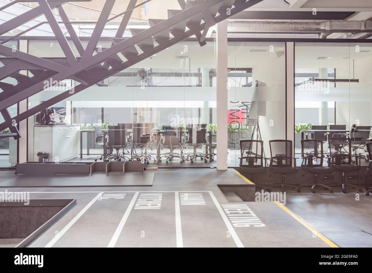 Empty workplace with computers and conference room Stock Photo
