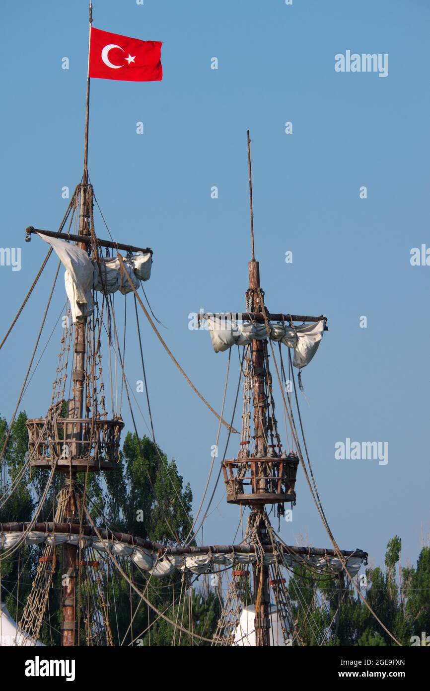 Mast and sail of a Wooden Turkish Ship With Flag and Ropes Stock Photo