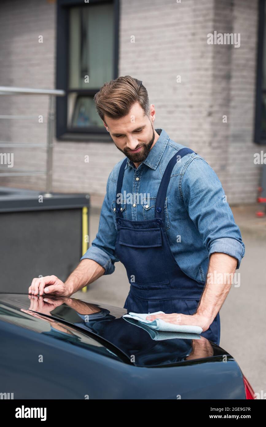 Mechanic in uniform waxing hi-res stock photography and images - Alamy