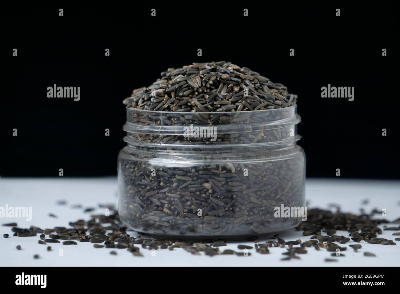 Black flax seeds in jar, Linum usitatissimum, Satara, Maharashtra, India Stock Photo