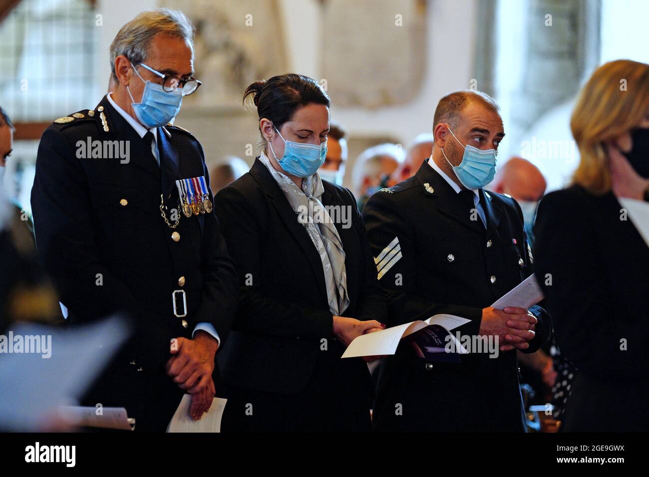 Devon and Cornwall Police Chief Constable Shaun Sawyer (L) attends a civic service at Minster Church Of St. Andrew to remember the people who were killed in a mass shooting on Thursday in Plymouth, Britain August 18, 2021. Ben Birchall/Pool via REUTERS Stock Photo