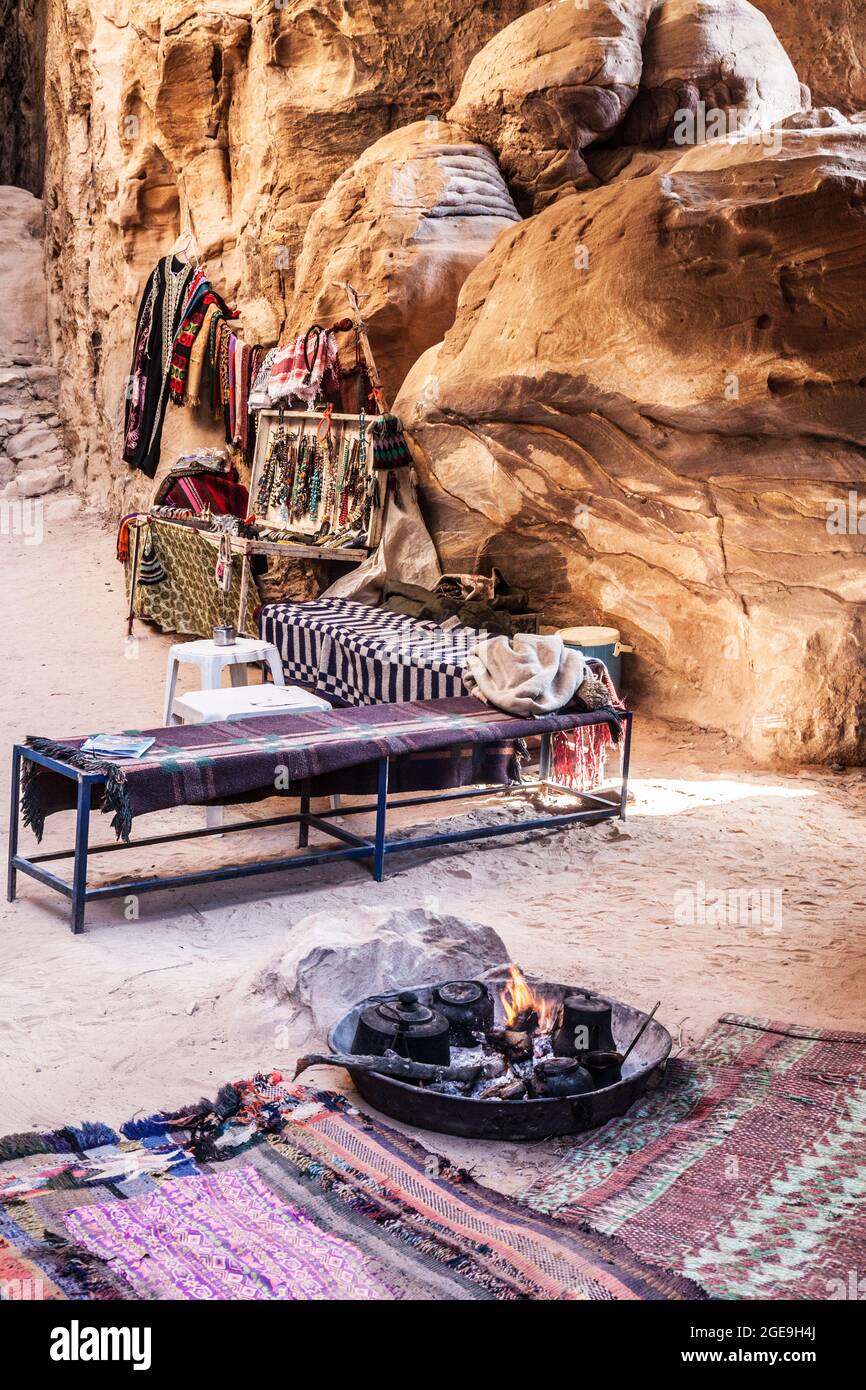 Bdul souvenirs and tea being brewed in Siq Al-Barid or Little Petra in Jordan. Stock Photo