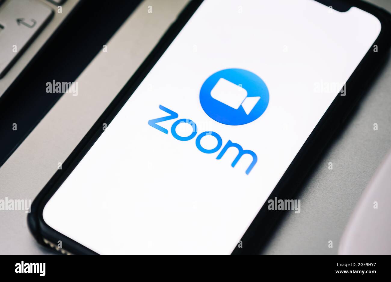 iPhone with Zoom video call app logo on the screen Stock Photo Alamy
