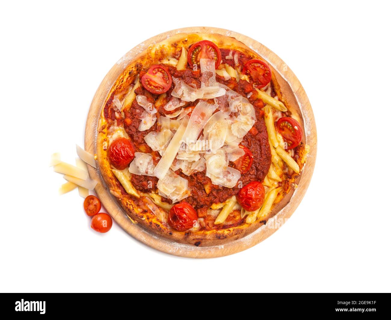 Pizza with penne rigate pasta, cherry tomatoes, tomato sauce  and grated parmesan cheese on wooden platter isolated on white background, high angle vi Stock Photo
