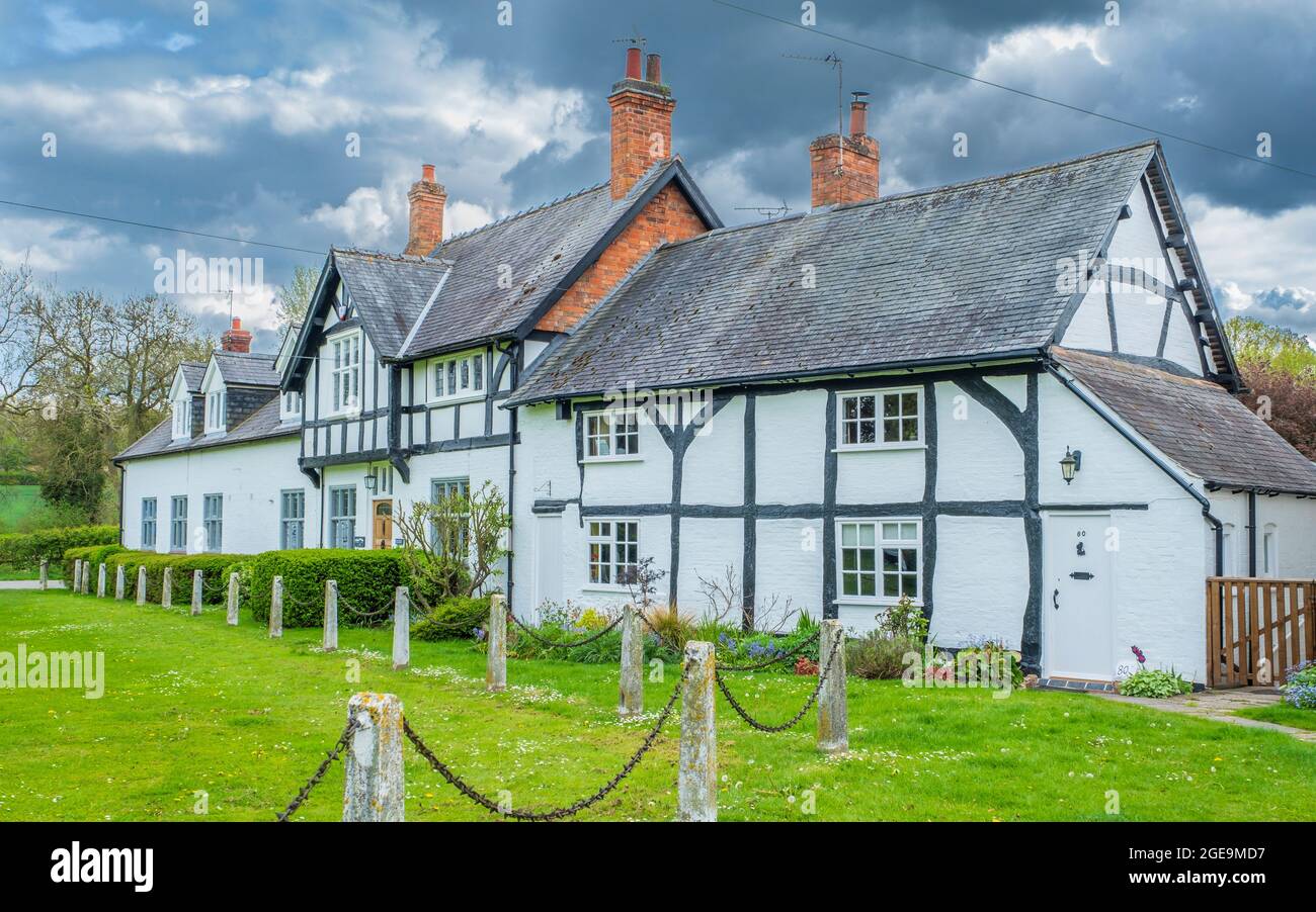 Traditional and stylish houses facing a village green. Stock Photo