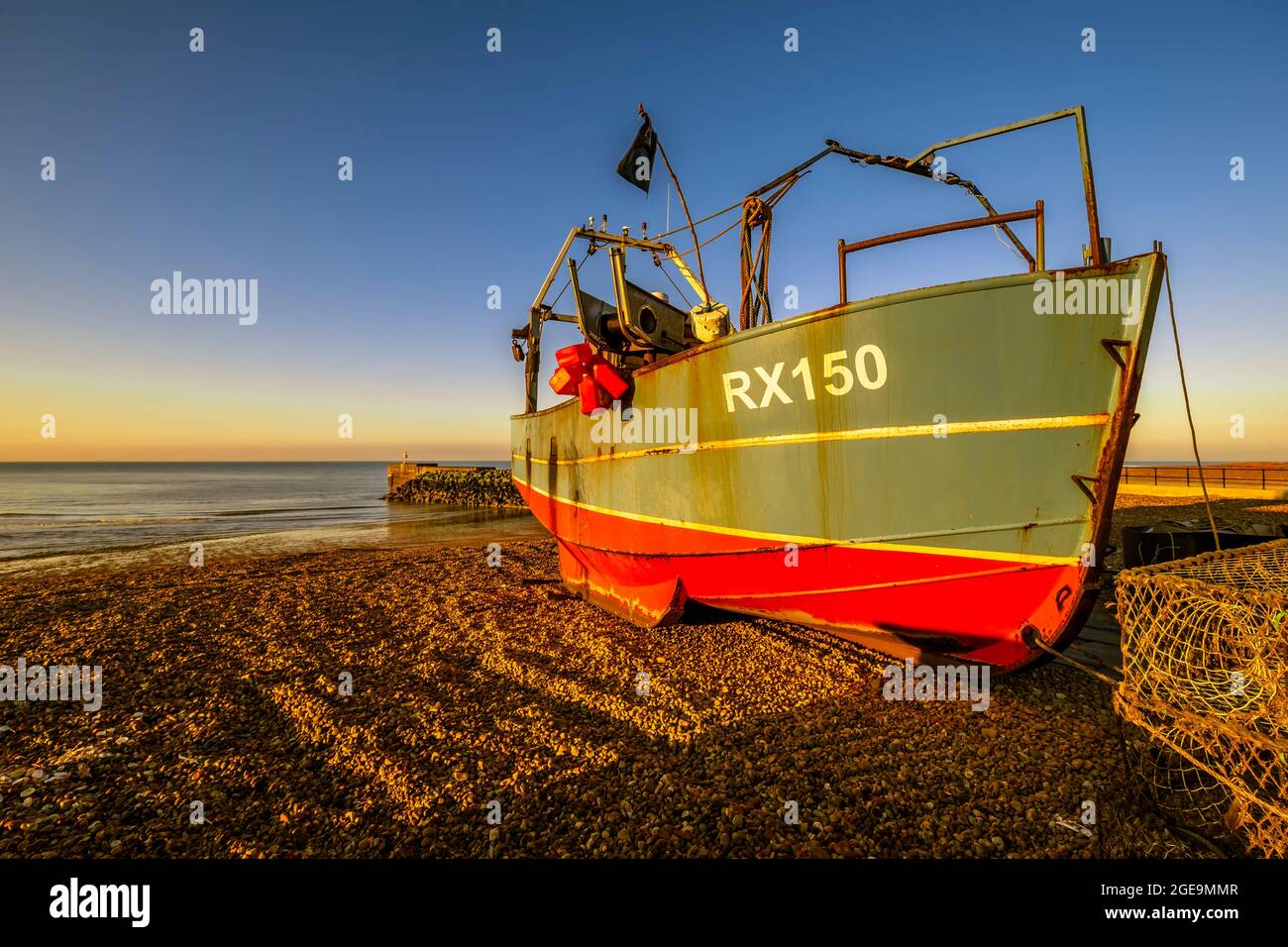 A fishing boat on The Stade beach in Hastings. Stock Photo