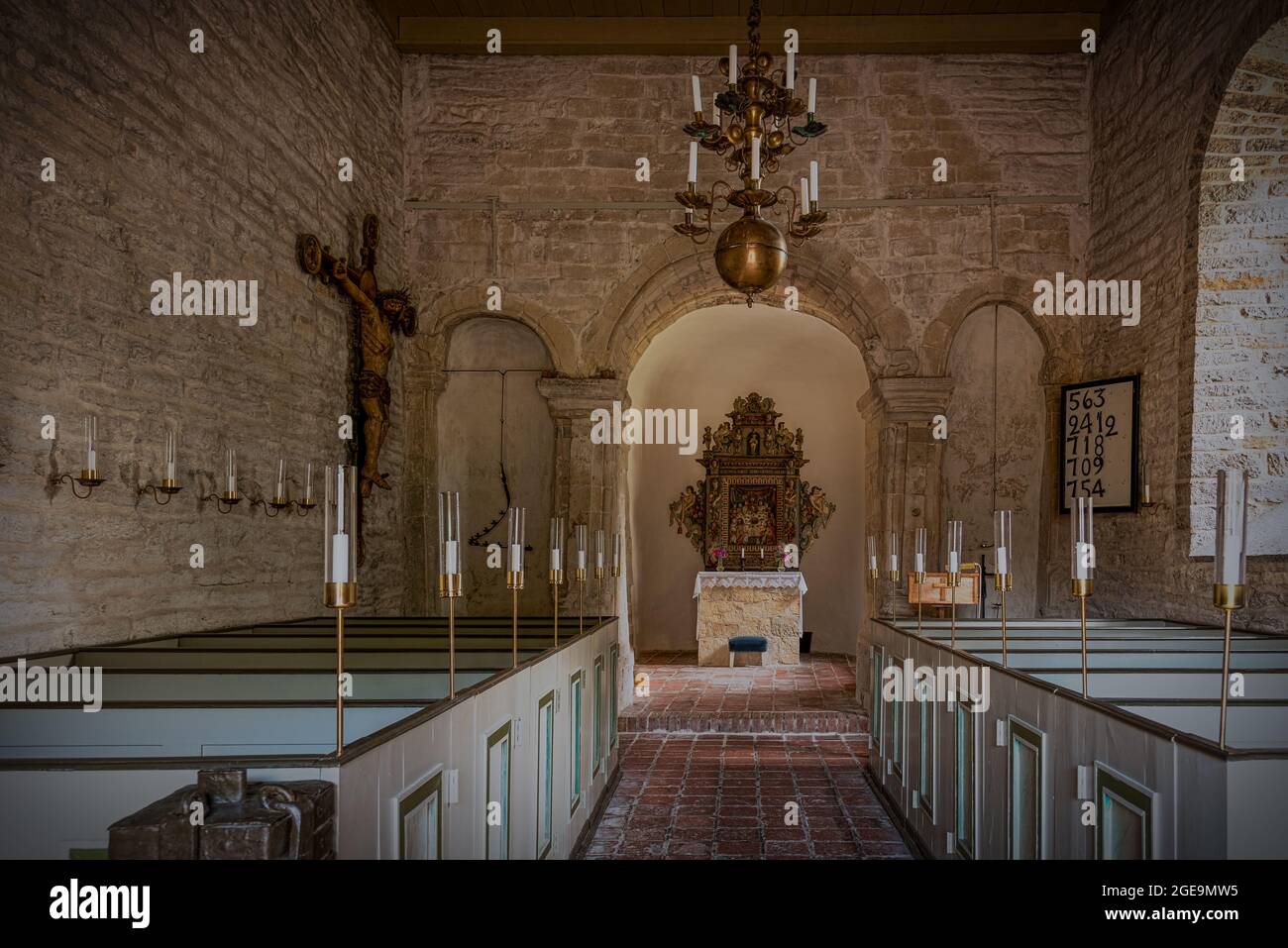 stone church in Sweden from the early 12th century with an ancient anglo-saxon triumphal arch, Borrie, Sweden, July 16, 2021 Stock Photo