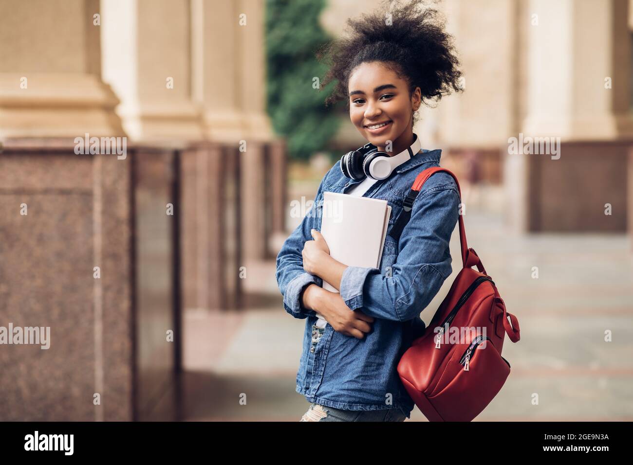 Hugging Books Cheerful Black Student Girl Hugging Books Posing Near College Building ...