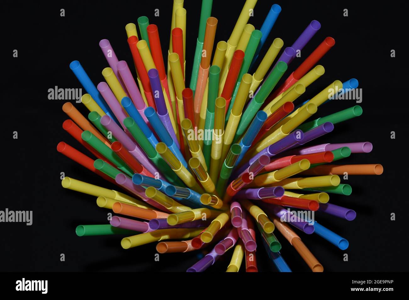 Plastic straws isolated on a black background. Stock Photo