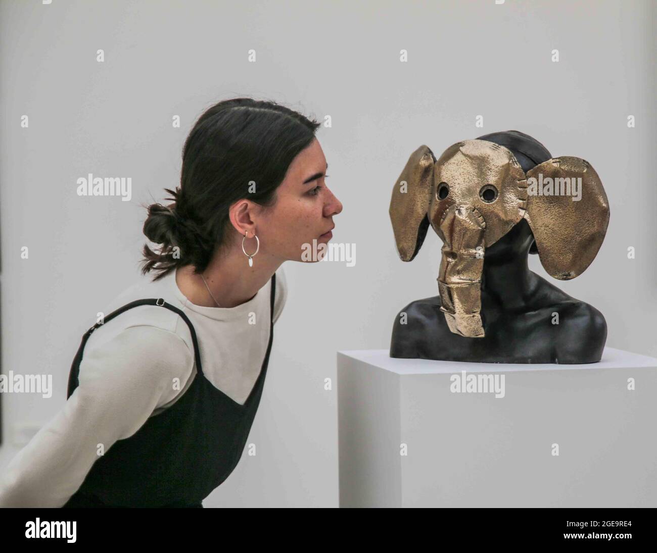 London UK 18 August 2021 RIGHT HERE RIGHT NOW. Charming Baker Nellephant (bronze) 2017.The 4,000 sq. ft exhibition will open in two gallery spaces at Saatchi Gallery on Thursday, 19 August 2021 until 9 September 2021.The exhibition features artworks by established artists such as Jake & Dinos Chapman, Charming Baker, David Shrigley and Chris Levine together with works by London based painter Matt Small and mural & installation artist Morag Myerscough. The show will also include previously unseen original work by Gary Stranger, Jessica Albarn, Eelus, Sara Pope and an exciting new collaboration Stock Photo