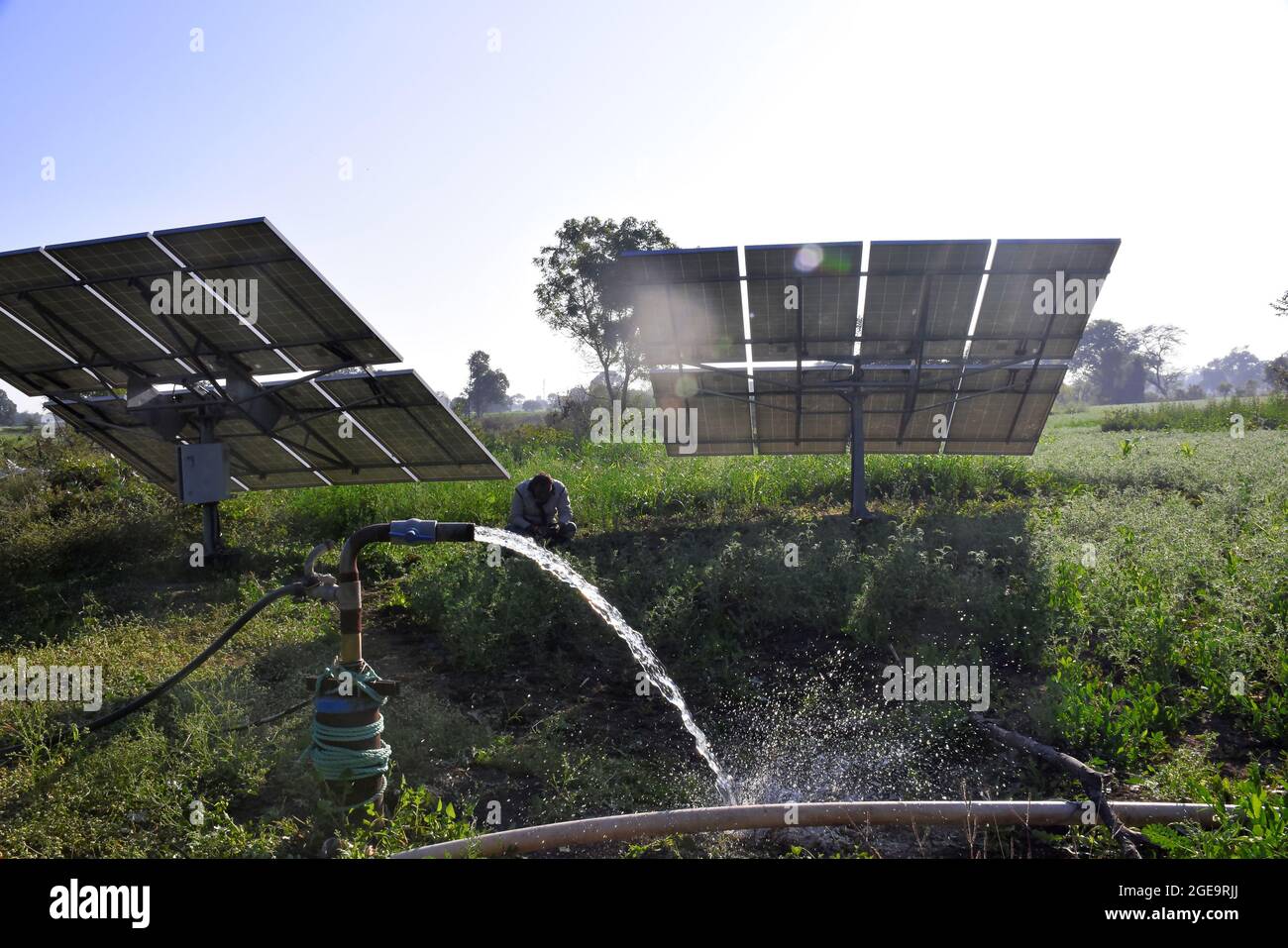 agricultural equipment for field irrigation, water jet, behind which is solar panel's, Stock Photo