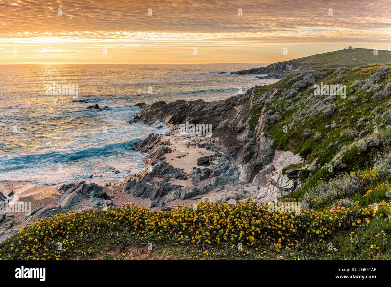 A spectacular sunset over the Celtic Sea seen from the coast of Newquay in Cornwall. Stock Photo