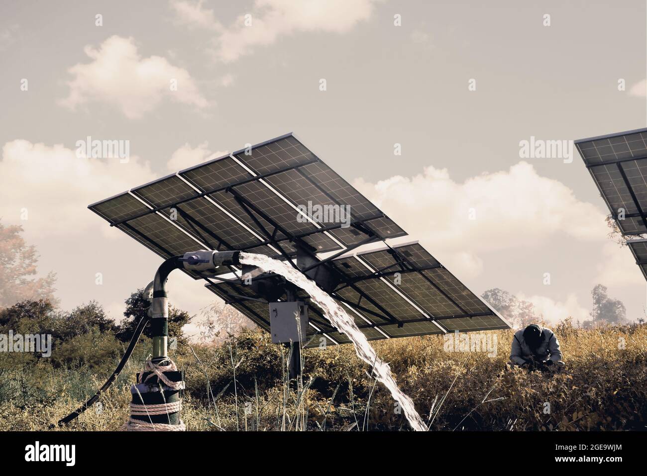 agricultural equipment for field irrigation, water jet, behind which is solar panel's, Stock Photo