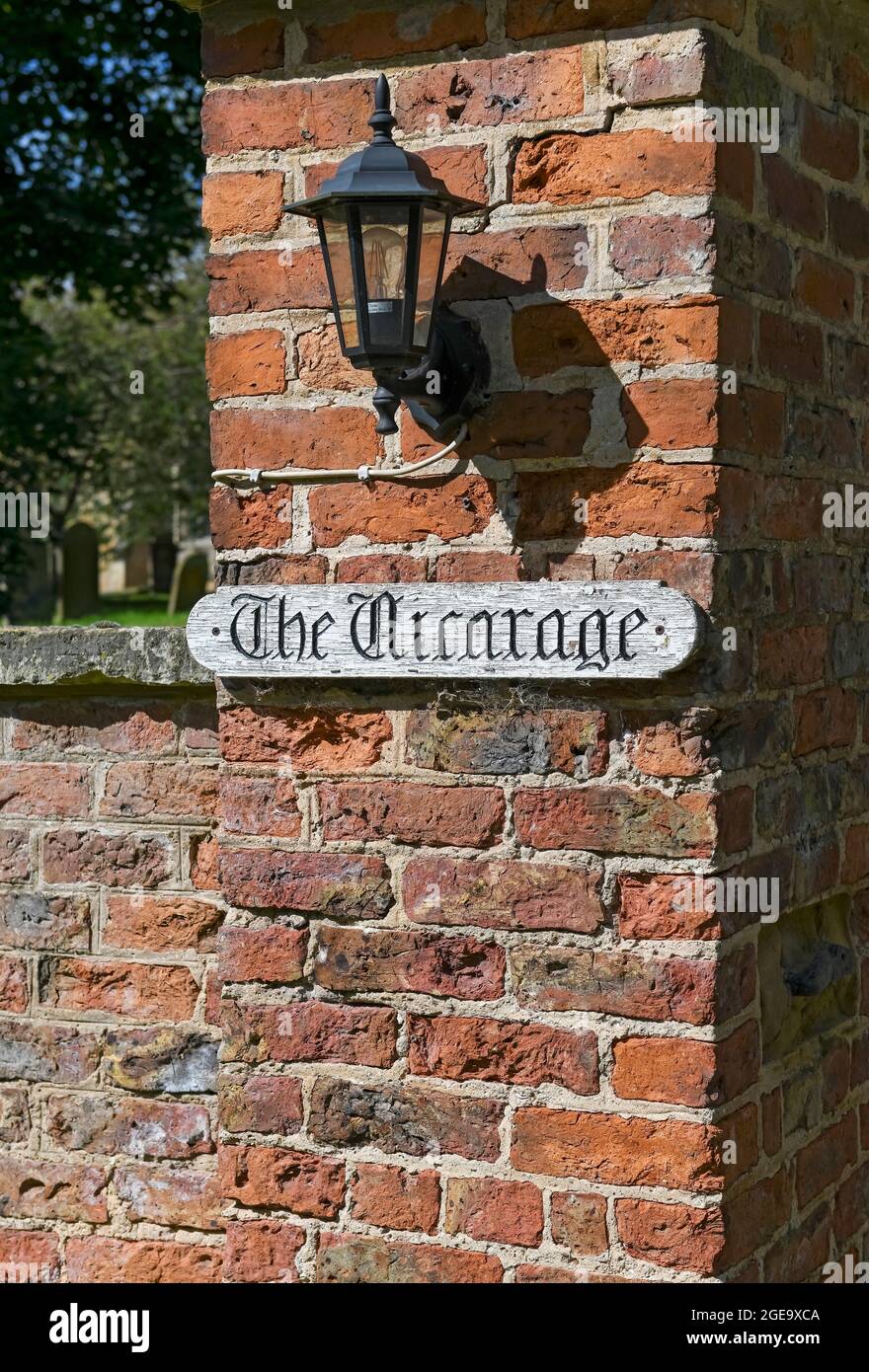 Close up of Vicarage sign on a brick wall. Stock Photo