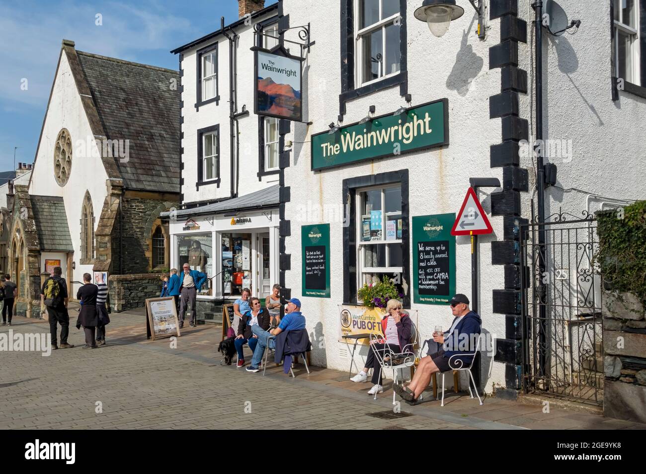 People sitting outside the Wainwright Inn in summer. Stock Photo