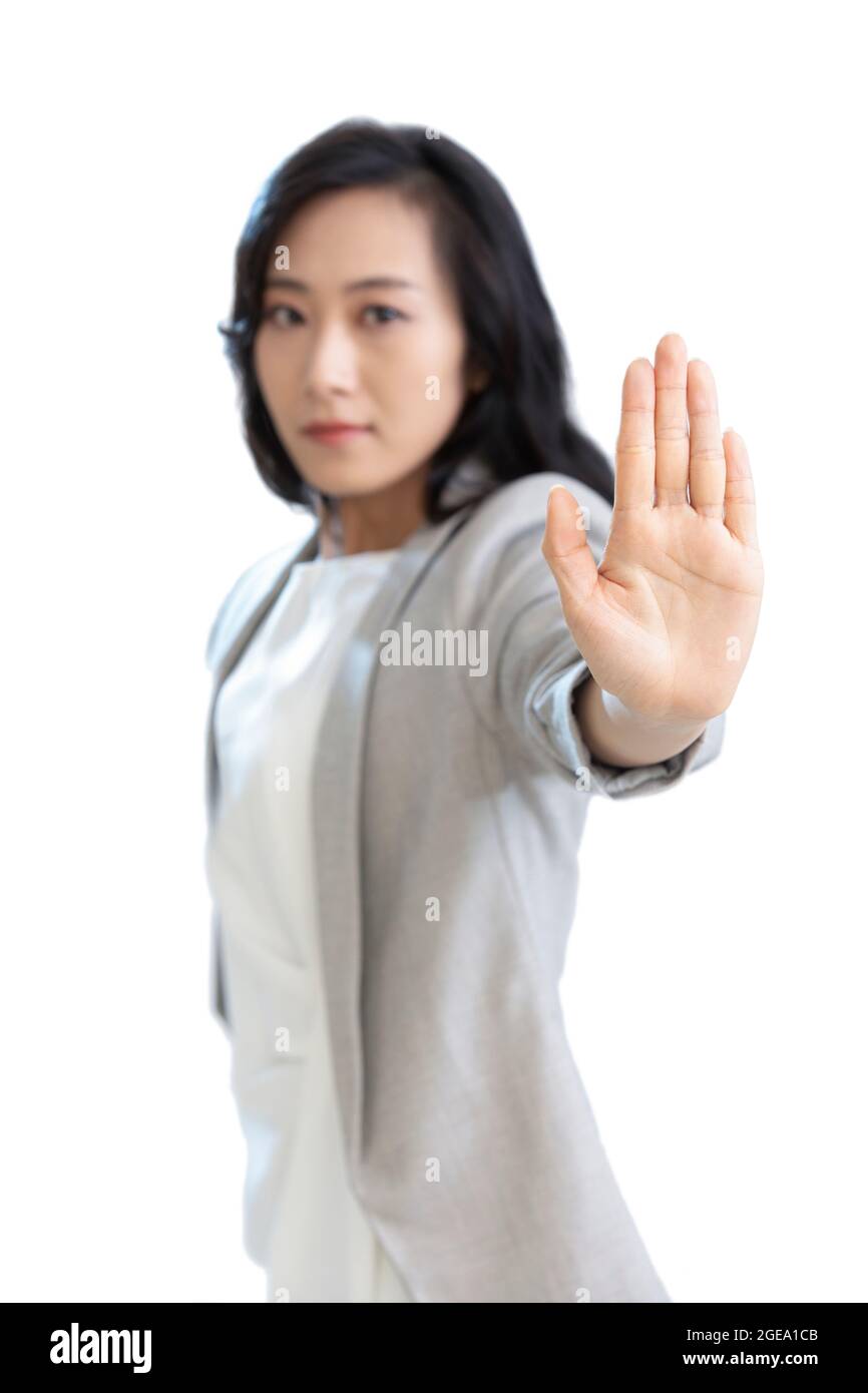 young-chinese-businesswoman-showing-stop-gesture-2GEA1CB.jpg