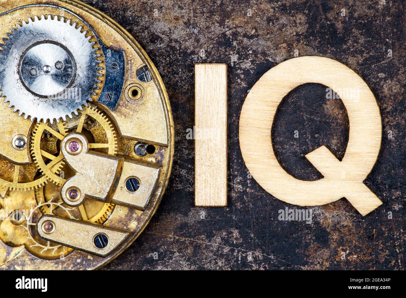 Intelligence quotient, iq test score and level concept. Antique clockwork gears with letters. Stock Photo
