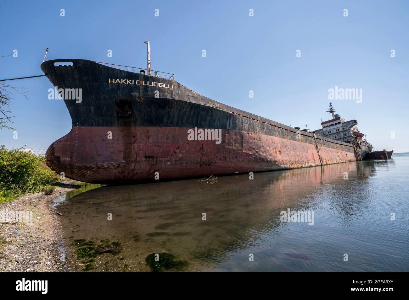 An abandoned cargo vessel lies beached along the Black Sea near the war torn city of Ochamchire in Abkhazia. Stock Photo