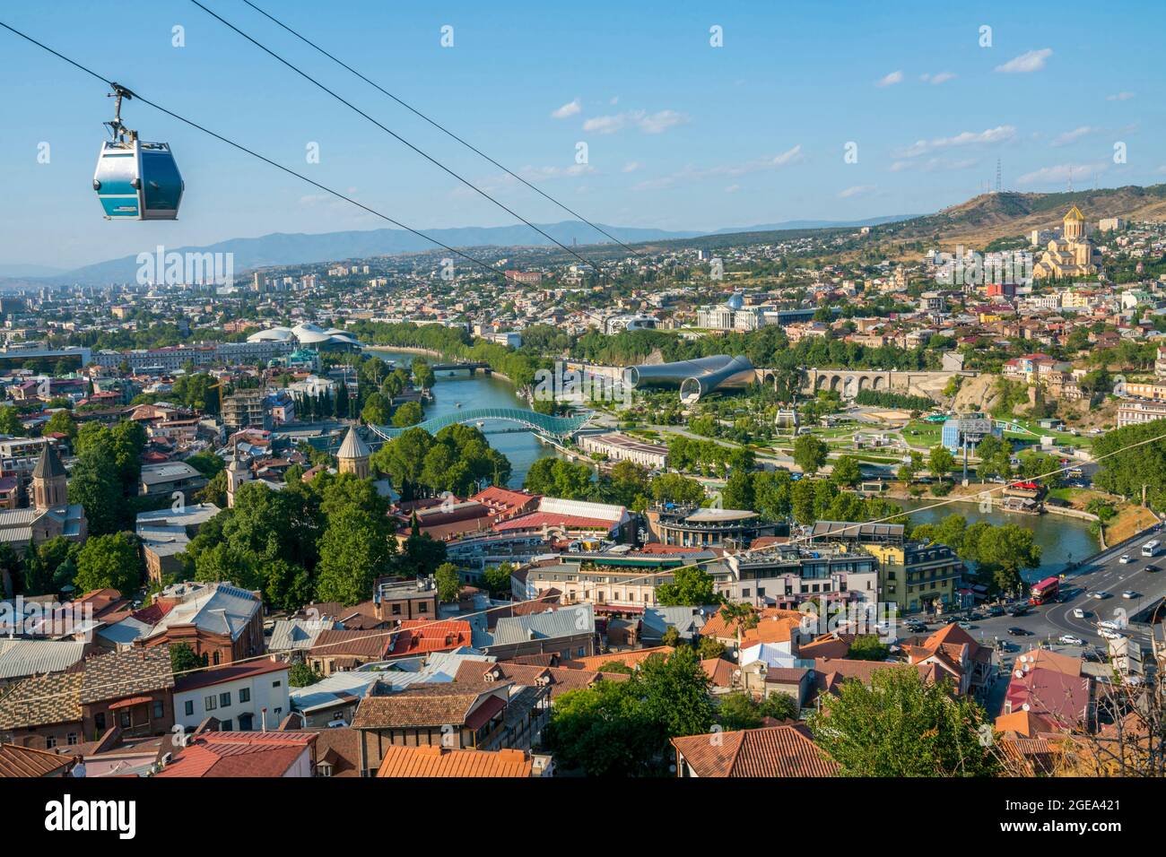 A cable car moves across a panoramic view of Tbilisi on its way to Narikala Fortress. Stock Photo