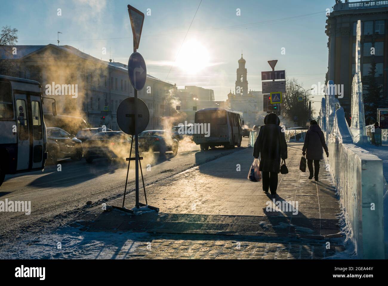 Exhaust catches the light of sunrise in the early morning chill of Ekaterinburg in Russia. Stock Photo