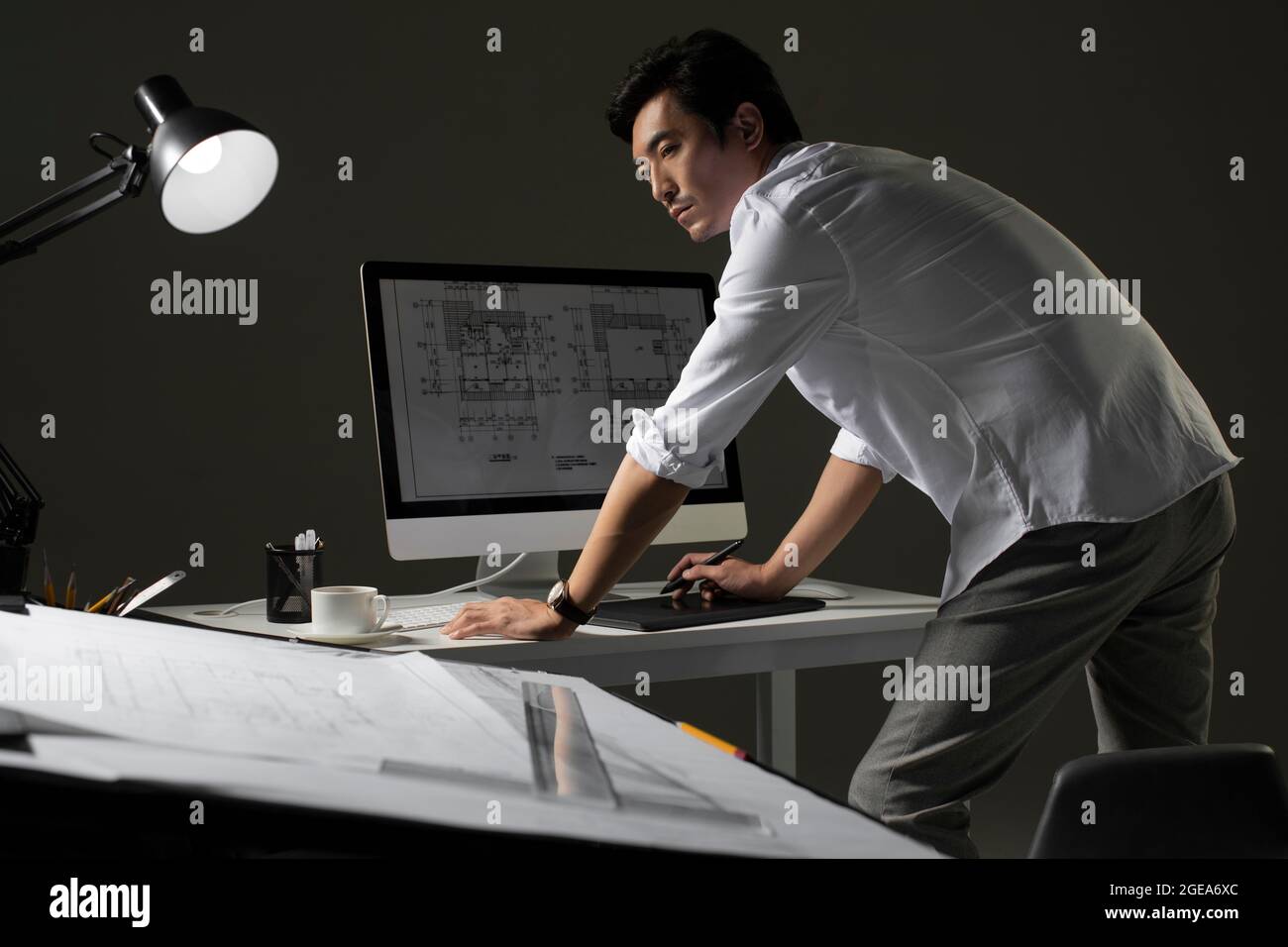 Chinese designer working on construction plan Stock Photo