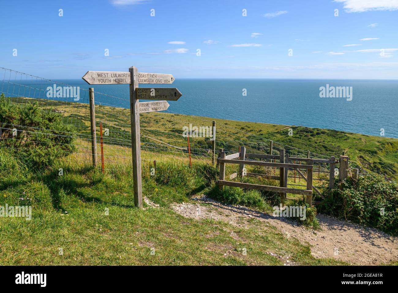 Signpost on the South West Coast Path at Lulworth Cove, West Lulworth, Dorset, UK Stock Photo